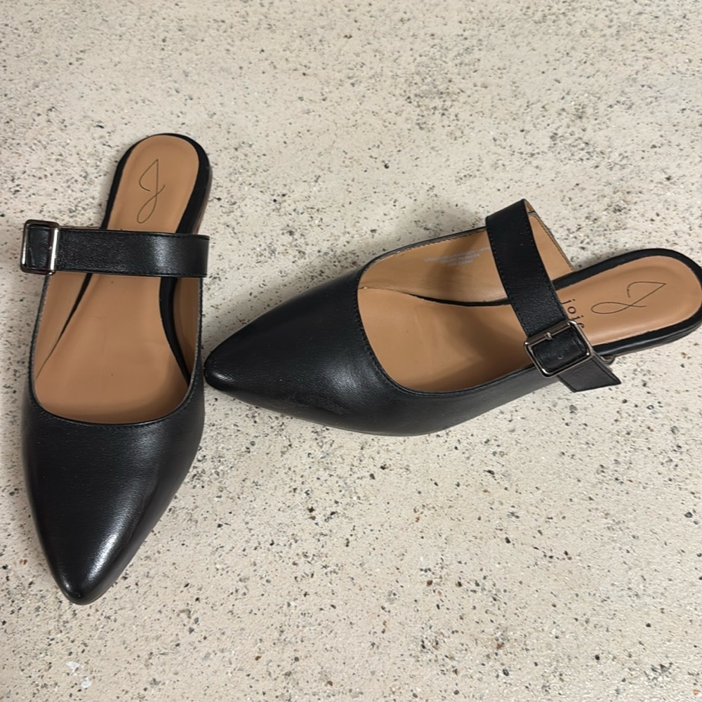 Genuine leather black slip on shoes with adjustable straps.